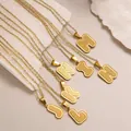 Textured gold letter pendants on O-chain necklaces featuring vertical striped patterns - Letter H