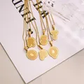 Golden textured letter pendant necklaces from O to T with striped 3D metal finish - Letter O