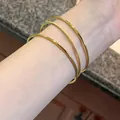 Dreilagige Armreifen aus 18K vergoldetem Titanstahl mit polierter und matter Optik - Drei Leben Armreif (z338) / 60mm Durchmesser / Gold