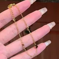 Elegante 18K vergoldete Titanstahl-Halskette mit drei Herzanhängern und Karabinerverschluss - Drei Herzen Armband Gold