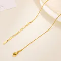 Close-up of gold plated stainless steel snake chain with lobster clasp and logo tag - Round Snake Chain / 40+5cm / Gold