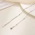 Detailed macro view of silver stainless steel chain with lobster clasp and S.STEEL stamp - Beaded Snake Chain / 40+5cm / Steel