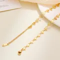 Detailed close-up of gold stainless steel heart chain showing S.STEEL logo tag and clasp - Hollow Heart Chain / 40+5cm / Gold