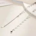 Close-up of stainless steel heart chain with lobster clasp and engraved tail tag - Hollow Heart Chain / 40+5cm / Steel