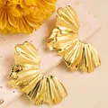 Detailed close-up of golden leaf-shaped earrings with fine radial texture and metallic gloss - Semi-Circular Crimped (ED240) / Gold