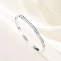 Macro detail of silver titanium steel bracelet with square cubic zirconia inlay - Steel Color Single Row Rhinestone