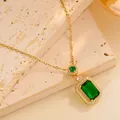 Luxurious gold emerald zircon pendant necklace displayed on a textured stone background - Emerald Green Zirconia (O-Chain) / Gold