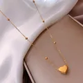 Gold beaded chain necklace with heart pendant made of polished stainless steel - Gold