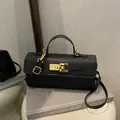Mini black Saffiano leather crossbody bag with top handle and golden twist lock - Black