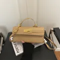 Mini Maillard-style khaki leather crossbody bag with gold metal clasp and top handle - Khaki