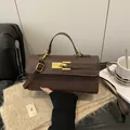 Mini brown cross-grain leather Kelly bag with gold buckle and crossbody strap - Brown