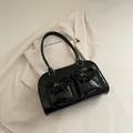 Glossy black shoulder bag with bow-knot pockets styled on a white blazer - Black without Pendant