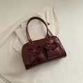 Chic burgundy patent leather shoulder bag with decorative bows and front pockets - Red (No Pendant)