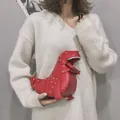Fashionable red dinosaur-shaped crossbody bag with gold rivets and metal chain strap - Red