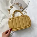Quilted ginger yellow handbag with woven handle and gold chain strap for women - Yellow