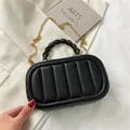 Elegant black quilted handbag with woven gold handle and slim metal chain strap - Black