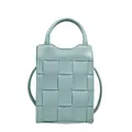 Light blue woven mini crossbody phone bag with short handle and slim shoulder strap - Blue