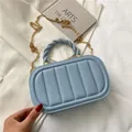 Elegant misty blue crossbody chain bag with vertical quilting and twisted top handle - Light Blue