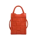 Orange woven crossbody bag with checkerboard pattern, top handle and leather strap - Orange