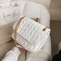 White faux leather crossbody bag with V-shaped quilting and golden chain strap - White