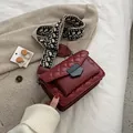Deep red quilted crossbody bag with vintage jacquard wide strap and metal lock - Burgundy