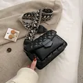 Quilted black crossbody bag with vintage pattern wide strap and metallic flap closure - Black