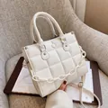 Elegant white quilted crossbody bag with decorative chain and adjustable strap - White