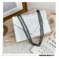 Detail of white snakeskin texture on a classic envelope crossbody bag with black metal chain - White