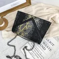 Fashionable black crossbody bag with metallic snakeskin pattern and chain strap - Black