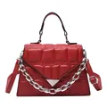 Red quilted faux leather handbag with silver triangle buckle and chunky chain strap - Red