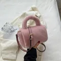 Pink faux fur crossbody bag with adjustable leather strap and fluffy plush texture - Pink