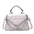 Quilted light pink faux leather crossbody bag with silver chain and top handle - White