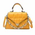Fashionable bright yellow crossbody bag with quilted texture and silver chain strap - Yellow