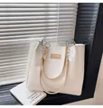 Elegant white quilted tote bag with chain strap and brand logo plate for street style - Khaki