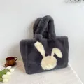 Borsa tote in peluche grigio scuro con silhouette di coniglio bianco e manici soffici - Grigio