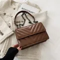 Brown quilted PU leather crossbody bag with black metal chain and flap closure - Brown
