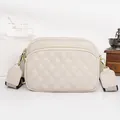 Beige quilted leather crossbody bag with dual zippers and a wide stylish strap - White