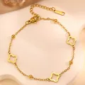 Gold stainless steel hollow clover charm bracelet with polished beads and lobster clasp - Gold Hollow Clover Style