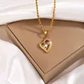 Gold-plated heart pendant necklace with white diamonds in a beige jewelry display box - Heart Inlaid