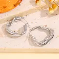 Orecchini a cuore a tre strati in acciaio inossidabile argento lucido con perno - Esagono Geometrico Argento