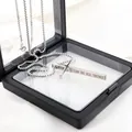 Silver stainless steel cross necklace with religious engraving in a black floating box - Silver Side-Engraved Cross (Box Chain)