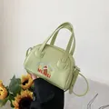 Light green PU leather crossbody bag with cartoon embroidery and adjustable strap - Green