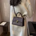 Deep brown retro crossbody bag with golden hardware and adjustable leather strap - Coffee