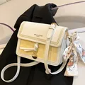 Contrast color small square bag in white and yellow with a decorative silk scarf - Yellow