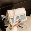 Chic white and light blue crossbody bag with gold chain strap and silk scarf - Blue