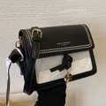 Crossbody bag in black and white leather with gold studs and a geometric silk scarf - Black