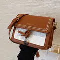 Brown and white patchwork crossbody bag with metal studs and tassel decoration - Brown