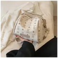 Fashionable cream white PU leather handbag with cute Keddy Bear pattern and top handle - Dark Brown