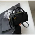 Classic black Boston bag in matte leather with gold hardware and removable shoulder strap - Black
