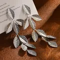 Silver leaf drop earrings in stainless steel with detailed vein textures and long dangle style - Leaf Tassel Stud Earrings / Silver